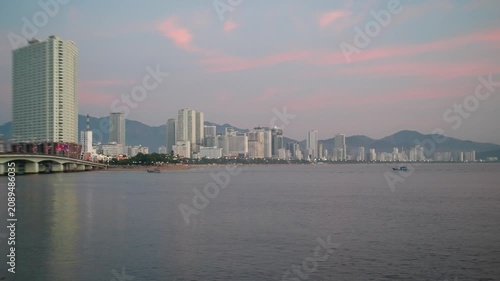 Nha Trang Vietnam. 01 06 2026 Nha Trang Vietnam. 01 06 2026 Dusk skyline over beachfront towers, arched bridge, and calm bay in Nha Trang Vietnam, with modern high-rises, soft pastel