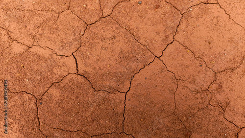 Canvastavla cracked red clay and sandy soil ground surface, creating a natural organic mosai