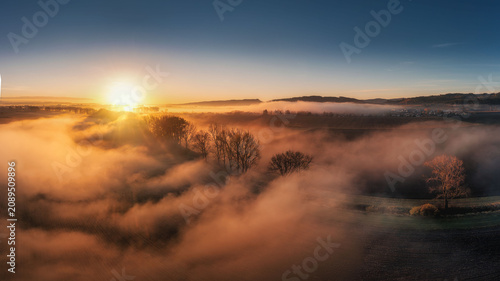 Obraz na płótnie view of the village of Spisska Teplica with fog at sunrise