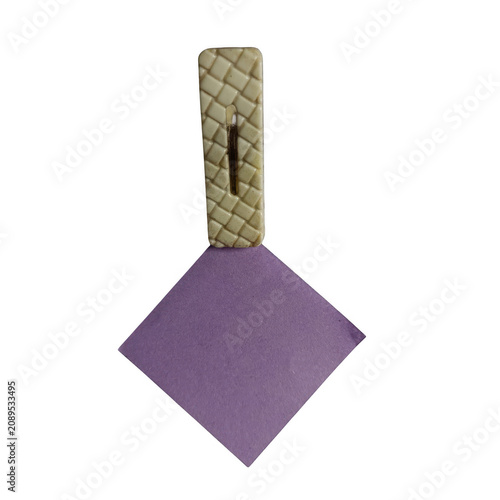 фотографія Purple geometric diamond-shaped paperweight on wooden stand