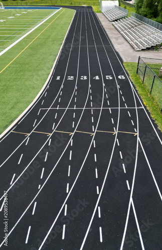 Quadro su tela Elevated View of Running Track with Bleachers and Football Field