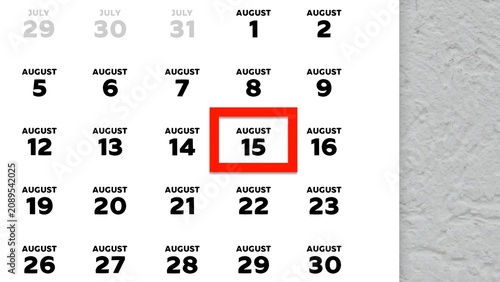 Close-up of August 15th date marked with a red cursor on a 2026 wall calendar