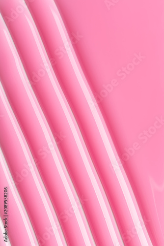 Abstract geometric background with pink diagonal lines and gloss