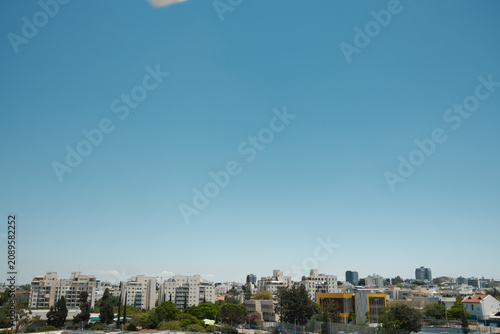 Wide Angle Panoramic View of a Residential Urban Neighborhood Under a Clear Blue Sky