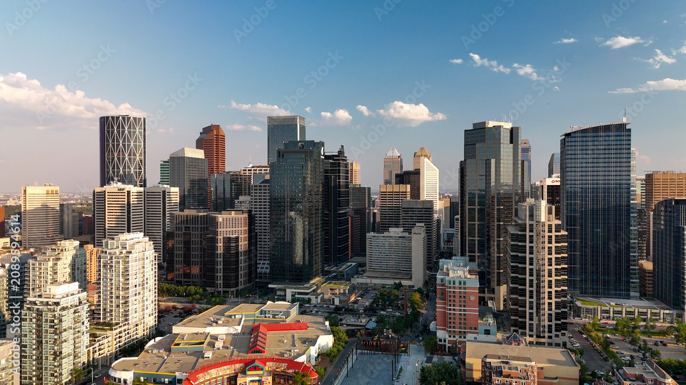 Fototapeta premium Calgary, Alberta - July 10, 2024: Aerial view of Calgary skyline on a beautiful summer sunset, Alberta - Canada