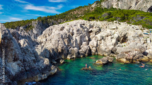 Εκτύπωση καμβά Beautiful aerial view of Capri lighthouse coastline beach with sunbathers and tu