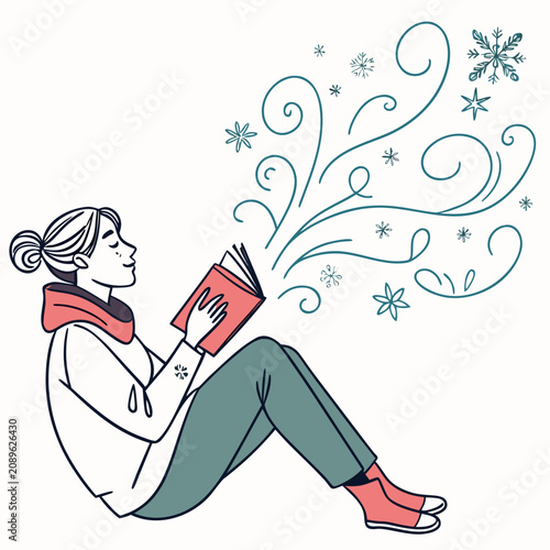 Young woman reading a book while sitting on the floor indoors  