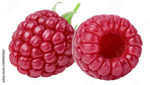 Foto Isolated two vibrant red fresh raspberries with green leaves, one whole and one with a hollow center