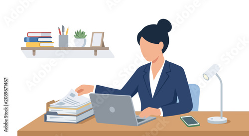 A professional woman sits at her wooden desk, multitasking between a laptop and a stack of paperwork in a clean, modern office setting.