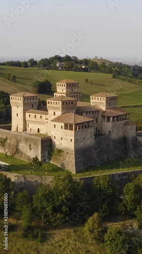 Vertical Aerial View of Torrechiara Castle and Scenic Italian Countryside