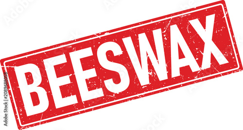 Red rectangular rubber stamp impression displaying the word beeswax in a bold distressed serif font style