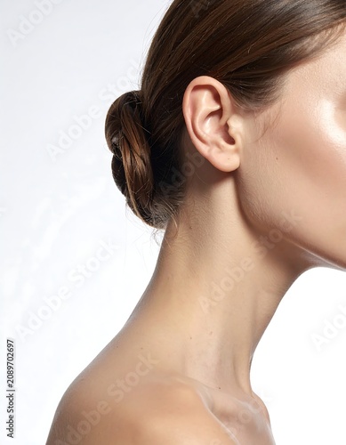 Close-up portrait of woman with elegant updo hairstyle.