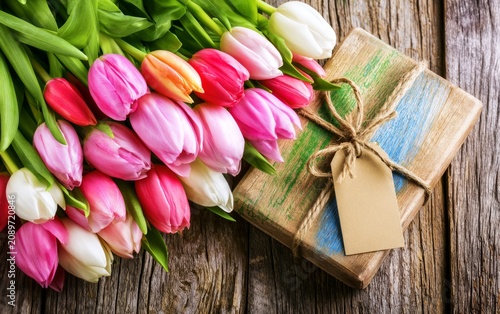 Fresh Tulips Overhead Floral Scene with Gift Package on Rustic Wooden Surface
