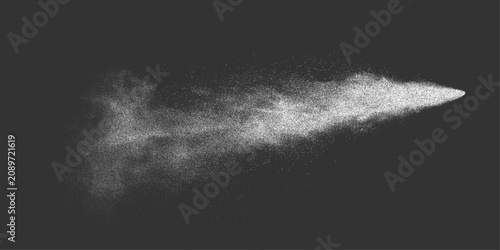 Fotografie Water spray mist atomizer dust aerosol stream in air from sprayer creating white