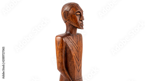 Tableau sur toile Traditional primitive wooden carved human figurine sculpture artifact isolated o
