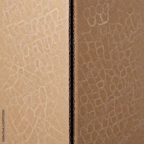 Cardboard texture with embossed grid pattern showing corrugated paper