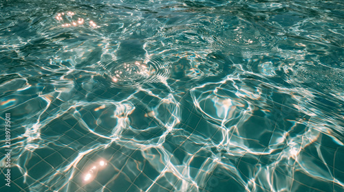 Turquoise pool water ripples macro with sun sparkles