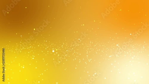Abstract golden yellow and warm orange gradient background with shimmering white bokeh particle lights and glowing magical dust dots for festive celebrations or luxury concepts
