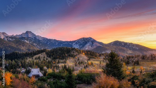 Schilderij op canvas Velika Planina plateau in Slovenia at sunset with fog
