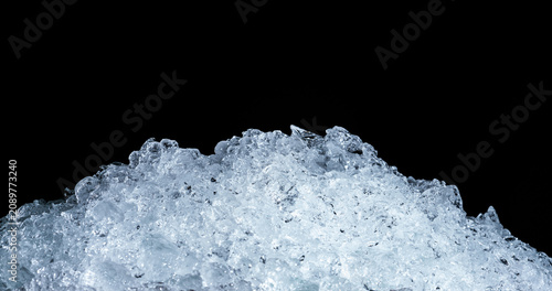 Fotografía Pile of crushed ice cubes on dark background with copy space