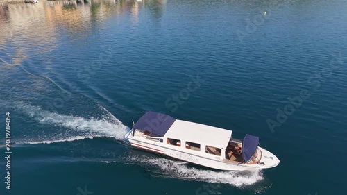Drone Orbit View of Passenger Boat Cruising on Calm Lake