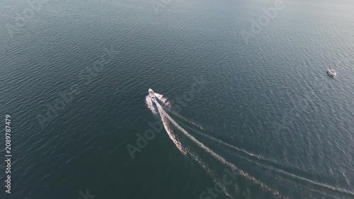 Drone Orbit Shot of Open Boat Cruising on Lake