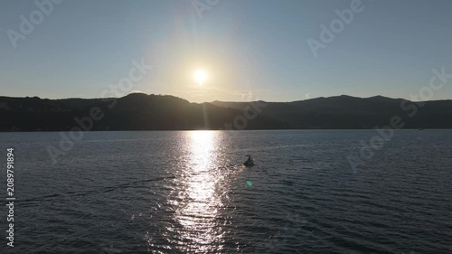 Aerial Sunset View of a Small Motorboat on Lake Maggiore
