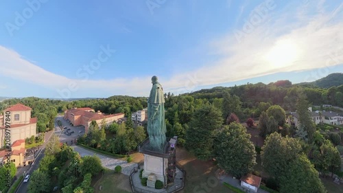 Sunset Aerial Shot of San Carlone Monument and Gardens in Arona