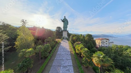 Aerial Sunset View of San Carlone Statue in Arona Overlooking Lake Maggiore