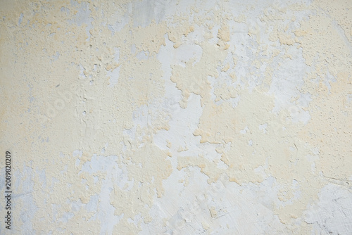 Grunge texture of peeling paint on old wall surface