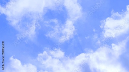 Fluffy White Clouds Moving Across Blue Sky Timelapse 4K