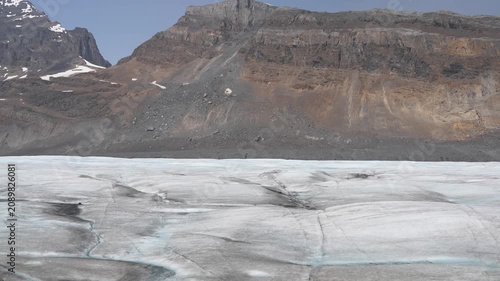 Stunning summer season view of Athabasca Glacier flowing from Columbia Icefield surrounded by alpine peaks Alberta wilderness