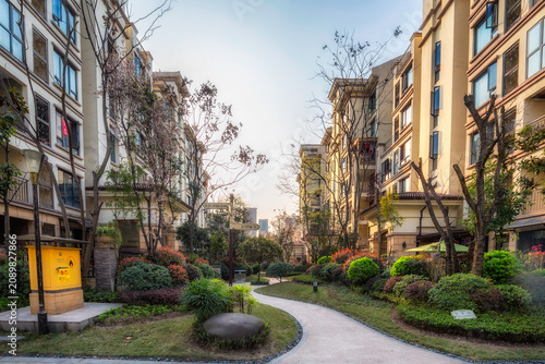 Modern Townhouse Complex with Manicured Gardens and Central Courtyard
