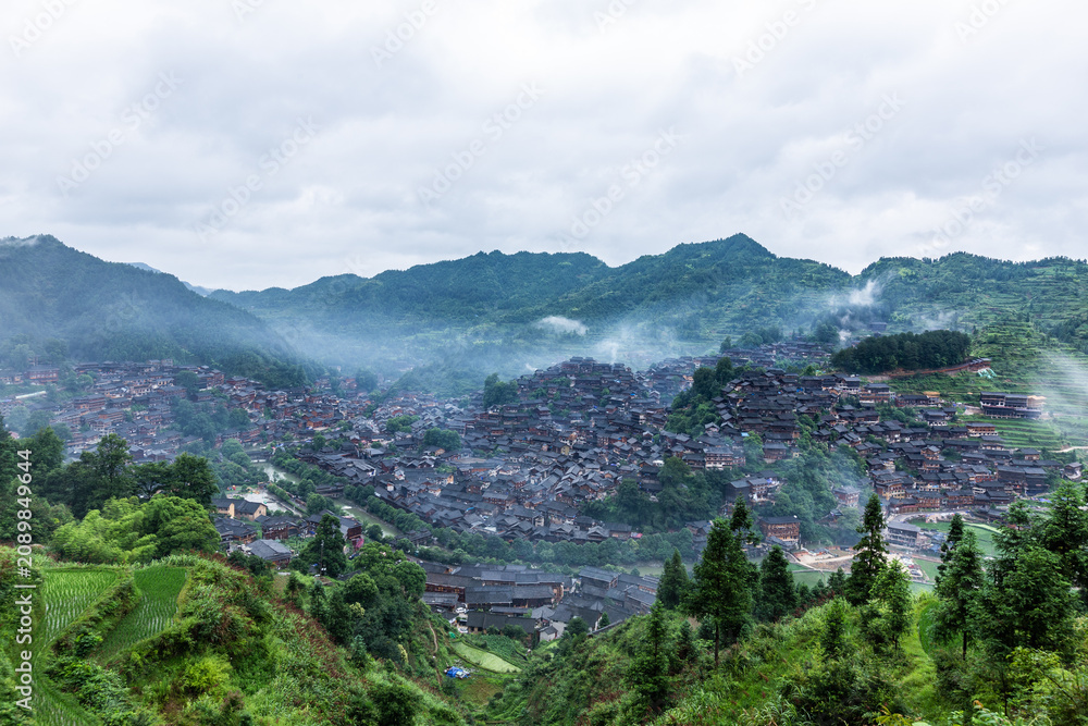 Fototapeta premium Xijiang Miao Village in Morning Mist, Guizhou China