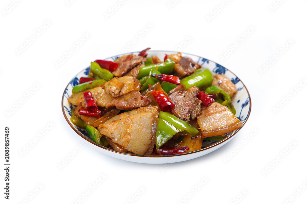 Fototapeta premium Spicy stir fried pork belly with green peppers and red chili on plate