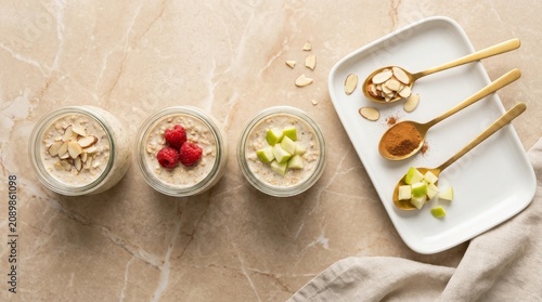 Tasty overnight oats topped with vibrant fresh fruits and crunchy nuts displayed on a stylish marble countertop