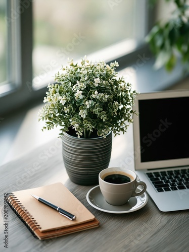 Tidy Minimalist Desk with Laptop, Coffee and Plants