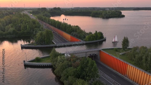 Veluwemeer Aqueduct, road crosses under a waterway in the Netherlands. Innovative intersection of highway and Water Bridge.