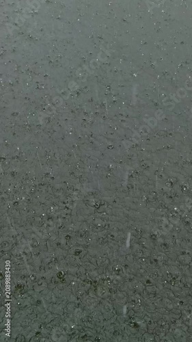 Heavy Monsoon Raindrops Falling on a Pond in Bangladesh – A Symbol of Seasonal Flooding