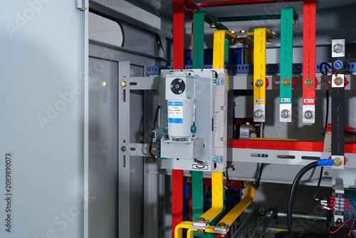 Konstfotografi Industrial electrical control cabinet interior with color coded busbars