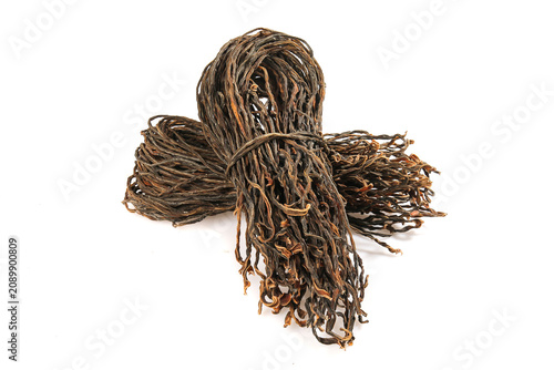 Dried Black Bean Noodles or Seaweed Pasta Bundles Isolated on White Studio Background