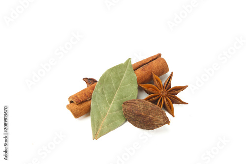Aromatic Cooking Spices with Cinnamon Star Anise Bay Leaves Studio Shot on White Background