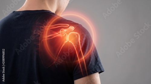 Man suffering from shoulder pain, highlighting the painful area with red circles, a common symptom of arthritis, bursitis, or rotator cuff injury.