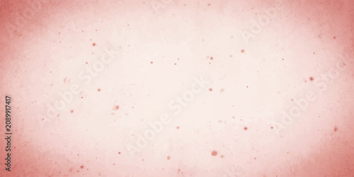 Photos Subtle red dust particles drift against a soft, textured pink background, creating an abstract and ethereal visual