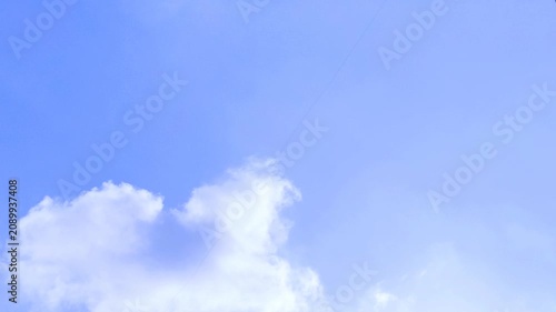 Small White Cloud Floating in Clear Blue Sky Timelapse 4K