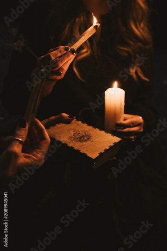 Woman Holding Candle and Incense 