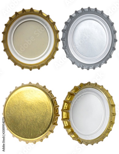 Set of four gold and silver metal rings on white background.