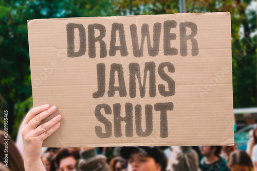 Fotografie "Drawer Jams Shut" Slide stuck halfway open