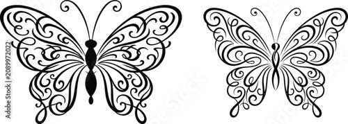 Two ornate butterflies in decorative swirling patterns black silhouette