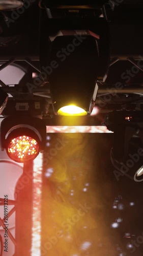 Spotlights in the concert hall. Stage light with colored spotlights and smoke.